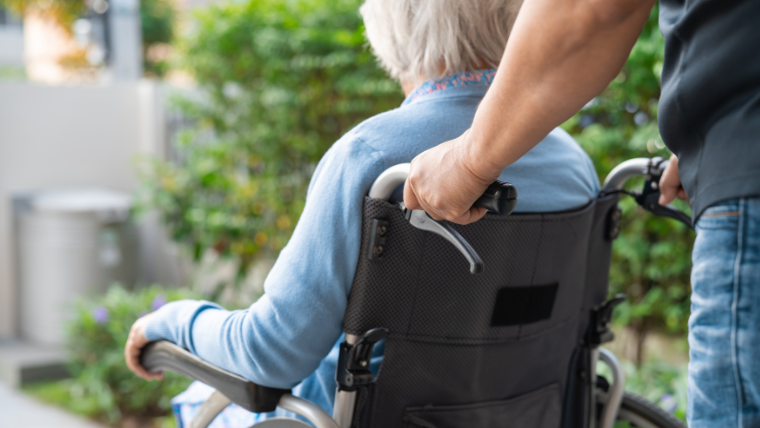 Jano Med-Ride driver assisting a seasonal resident at a South Florida medical appointment